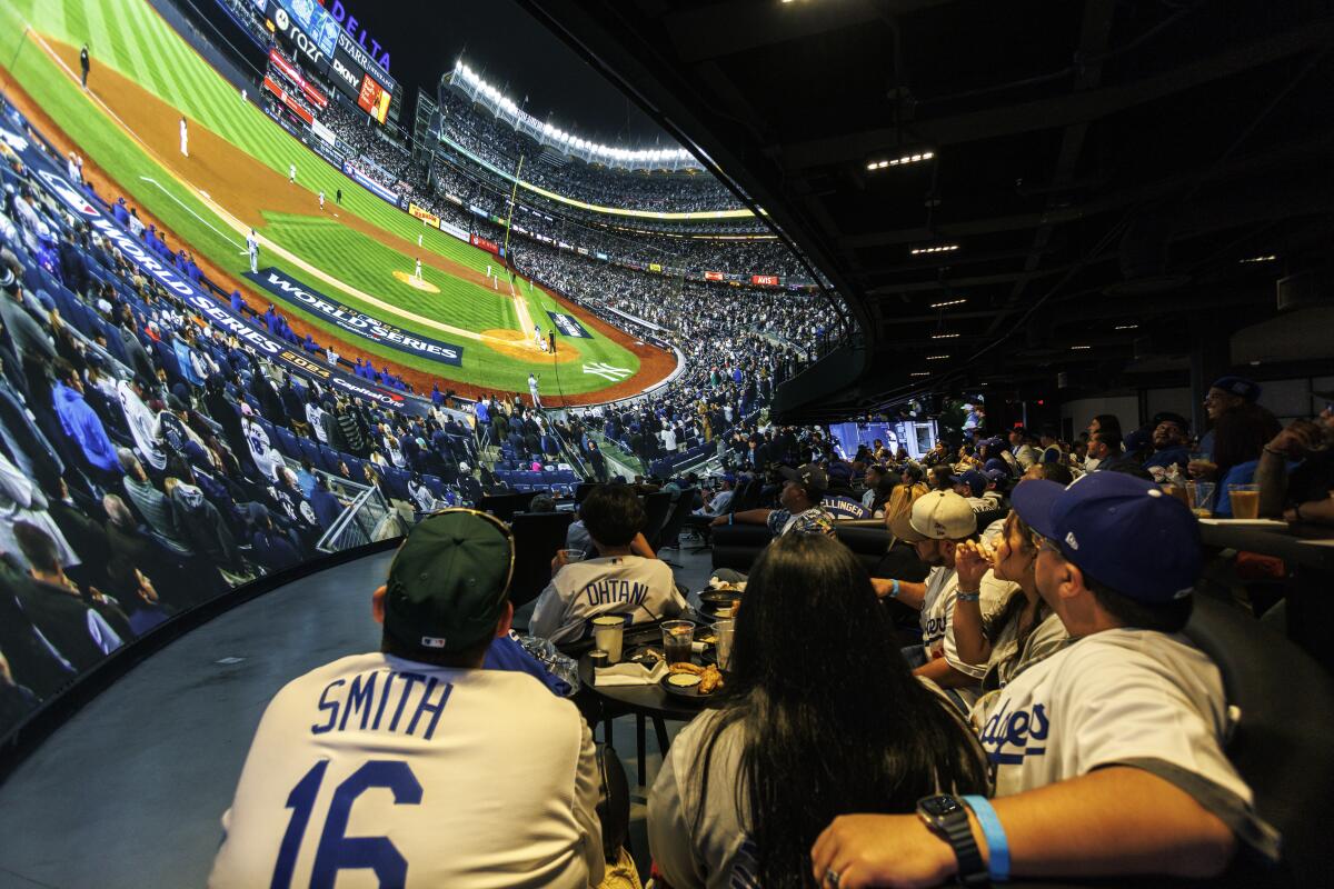 Fans enjoy cheering on Dodgers at immersive Cosm venue - Los Angeles Times